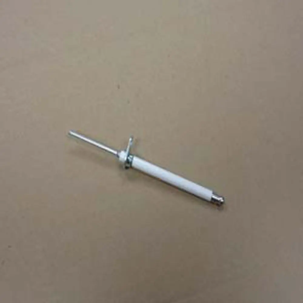 Ionisationselektrode von Remeha, bestehend aus einem weißen Körper mit einem Metallstab, auf einer neutralen Oberfläche liegend.